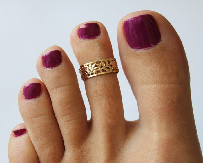 Calypso Gold Fill Adjustable Toe Ring shown on a pedicured foot