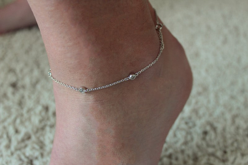 Bevel Set CZ Sterling Silver Anklet shown on an ankle