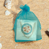 GOLD heart chain anklet in organza gift bag sitting on a sany beach
