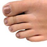 Four Strand Gold Adjustable Toe ring shown on a toe