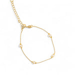 Gold small bead chain bracelet with pearl accents. 7" in length and 2" lead chain for sizing. 