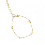Gold small bead chain bracelet with pearl accents. 7" in length and 2" lead chain for sizing. 
