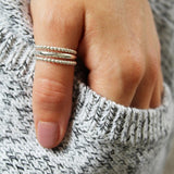 Bee Bee Stack Sterling Thumb Ring shown on a hand model