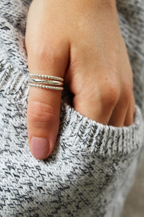 Bee Bee Stack Sterling Thumb Ring shown on a hand model