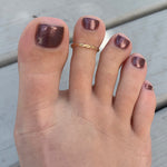 Braid Skinny Toe Ring shown in 14k gold fill on a foot