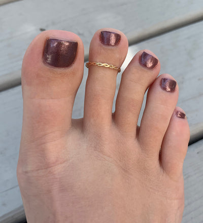 Braid Skinny Toe Ring shown in 14k gold fill on a foot
