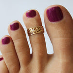 Calypso Gold Fill Adjustable Toe Ring shown on a pedicured foot