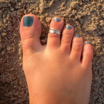 3mm Flat Sterling Toe Ring shown on a foot in the sand