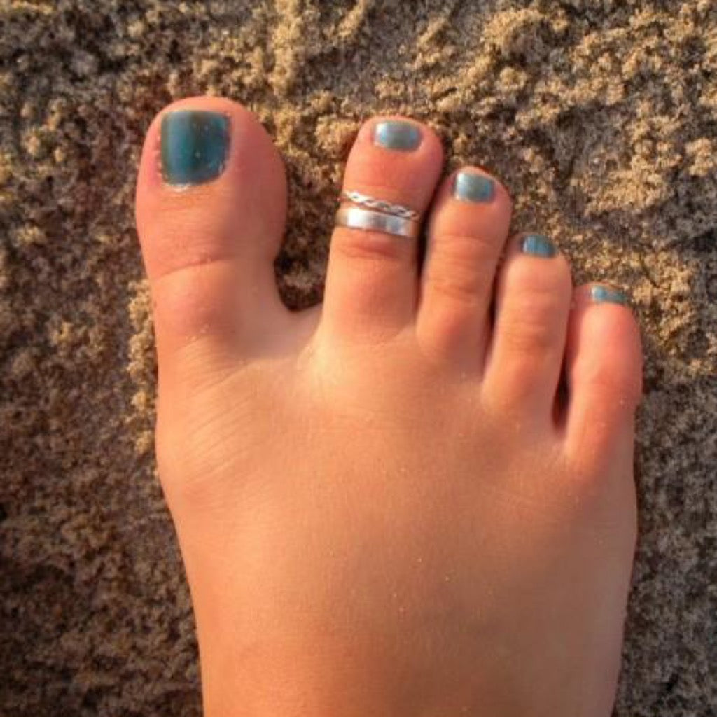 3mm Flat Sterling Toe Ring shown on a foot in the sand
