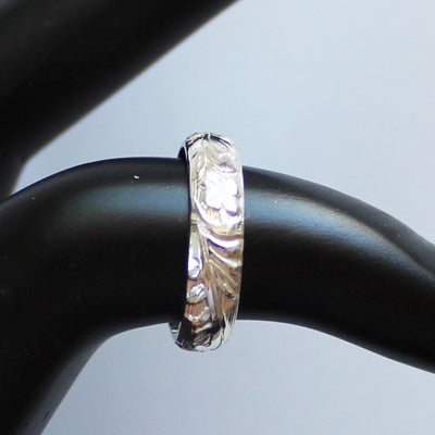Garden Party Sterling Toe Ring shown on a finger model