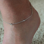 Bevel Set CZ Sterling Silver Anklet shown on an ankle