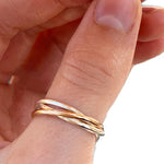 Rolling Interlock Sterling and Gold Fill Thumb Ring shown worn on a thumb