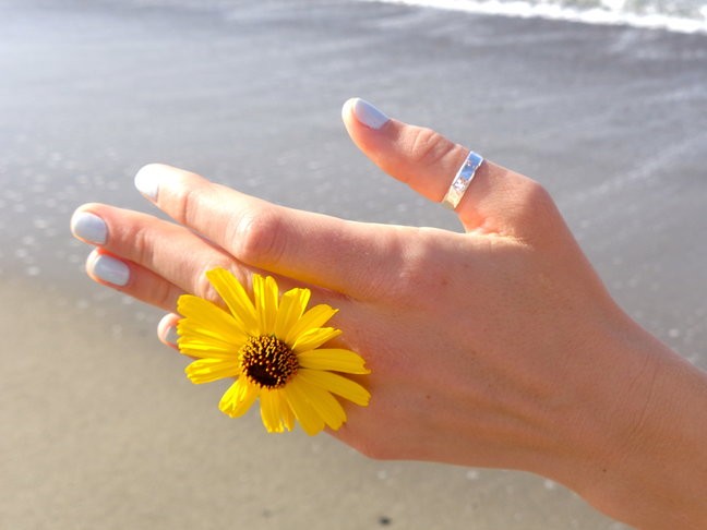 5mm Hammered Sterling Thumb Ring shown on a hand