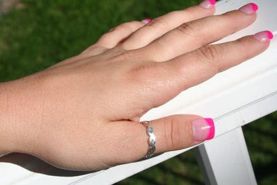 Braid Brawny Sterling Thumb Ring shown on a woman's hand
